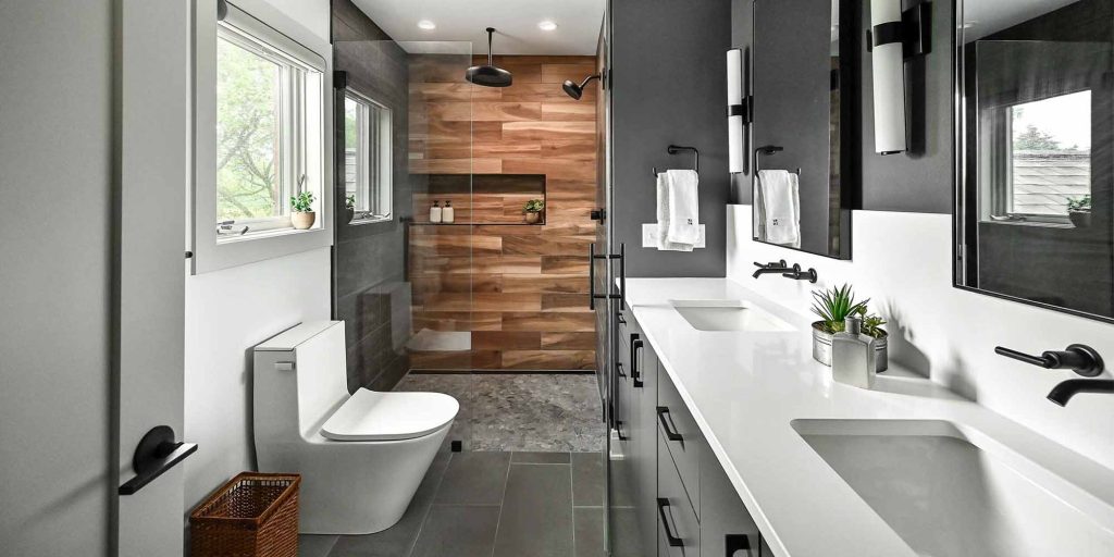 A bathroom remodel featuring a double sink and modern fixtures/finishes