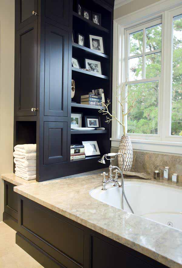 A small bathroom remodeled with built-in storage to save space